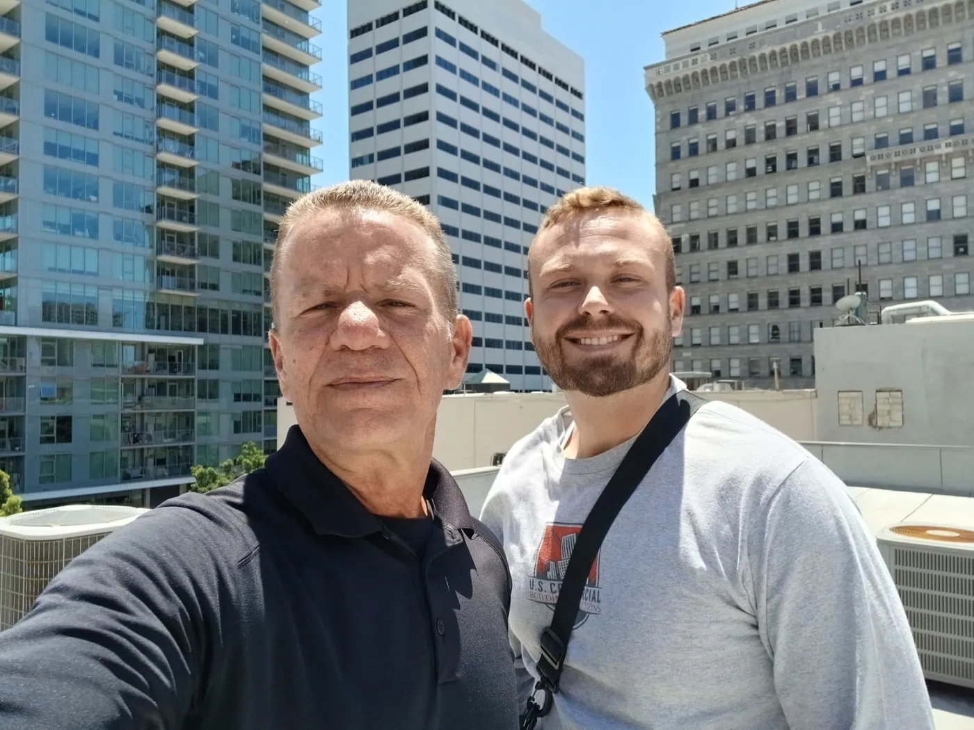 Maurice Bedard and a USCBI inspector on a commercial rooftop in downtown San Diego